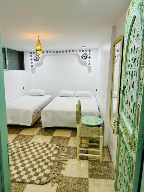 Postel nebo postele na pokoji v ubytování Riad Cascada