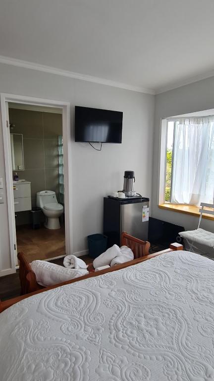 Postel nebo postele na pokoji v ubytování B&B Rocas Santo Domingo