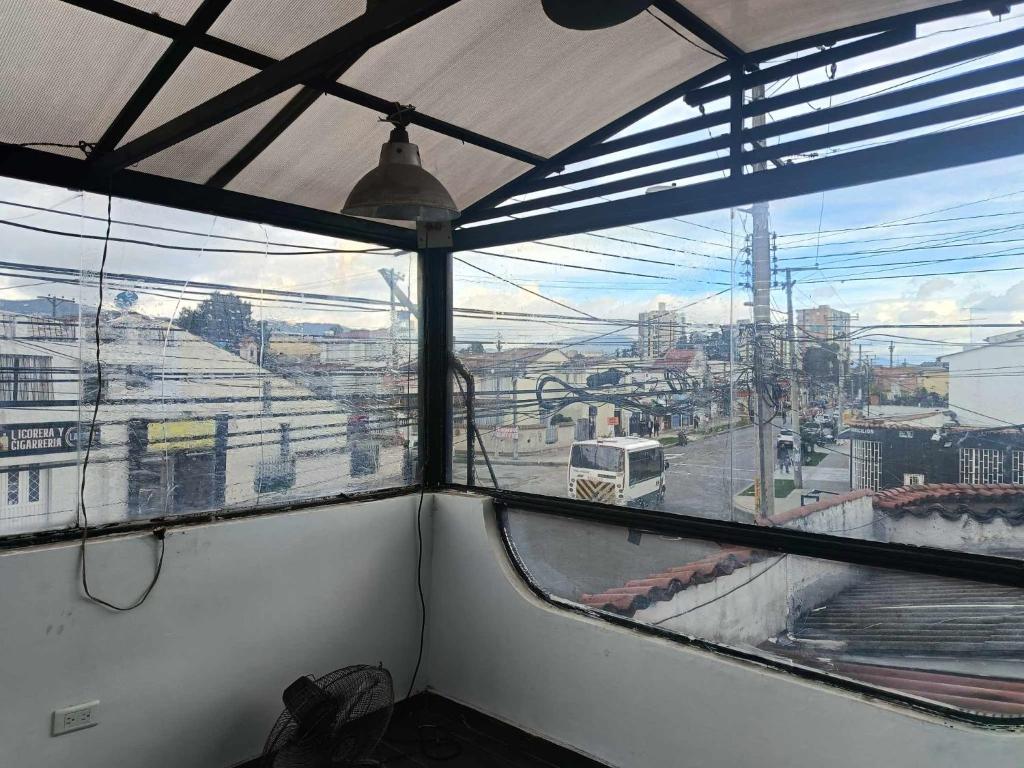 a window in a room with a view of a city at habitaciones disponibles en una casa en el norte de la ciudad, a 5 minutos del portal norte in Bogotá