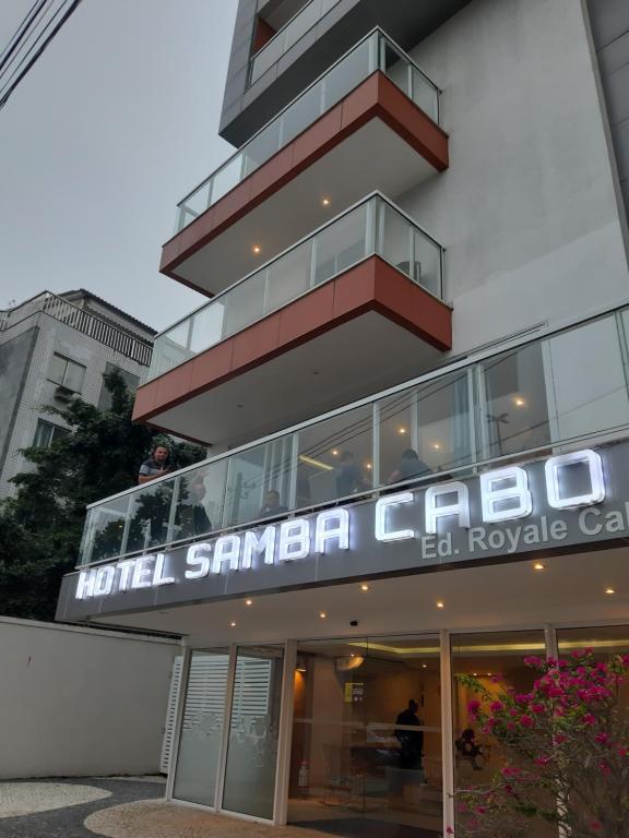 a building with a sign that reads hotel santa clara care at Flat Samba in Cabo Frio
