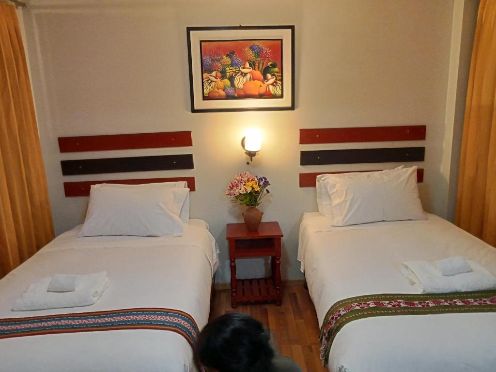 Postel nebo postele na pokoji v ubytování Raymi Inn MachuPicchu