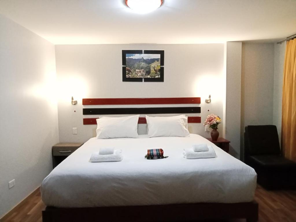 Postel nebo postele na pokoji v ubytování Raymi Inn MachuPicchu