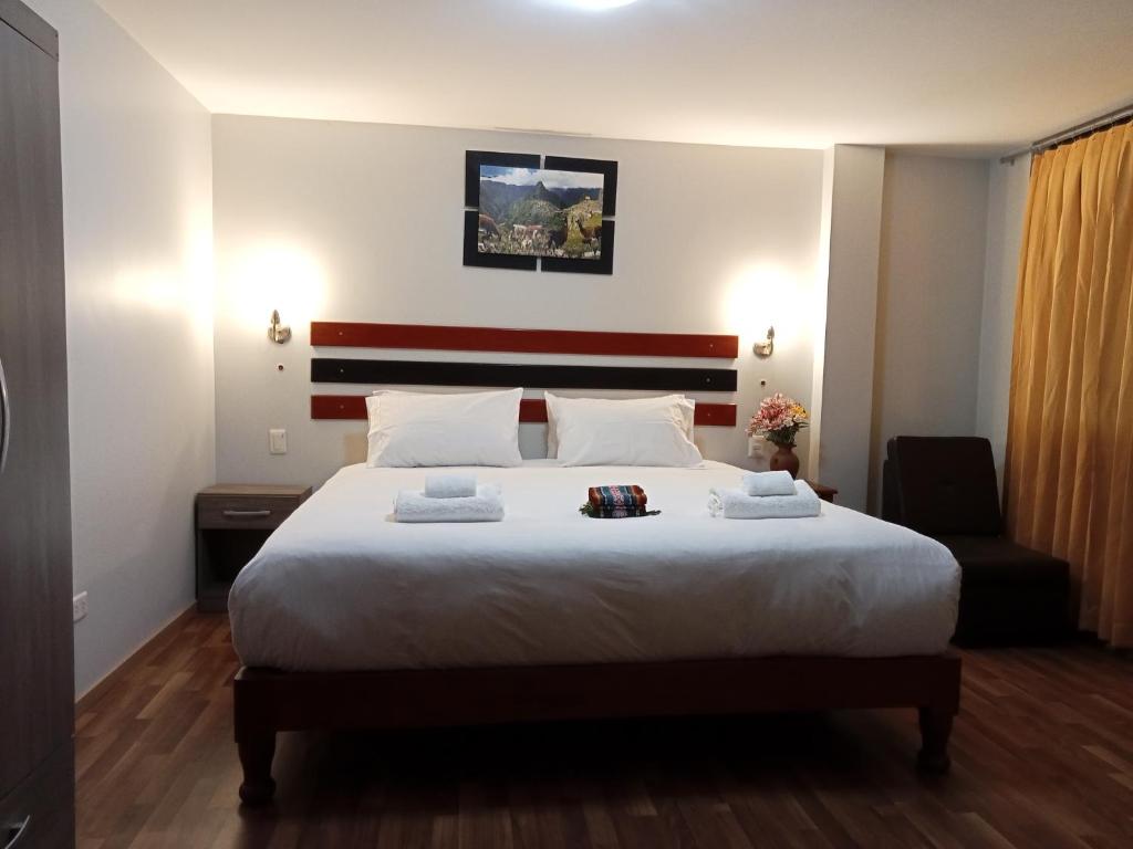 Postel nebo postele na pokoji v ubytování Raymi Inn MachuPicchu