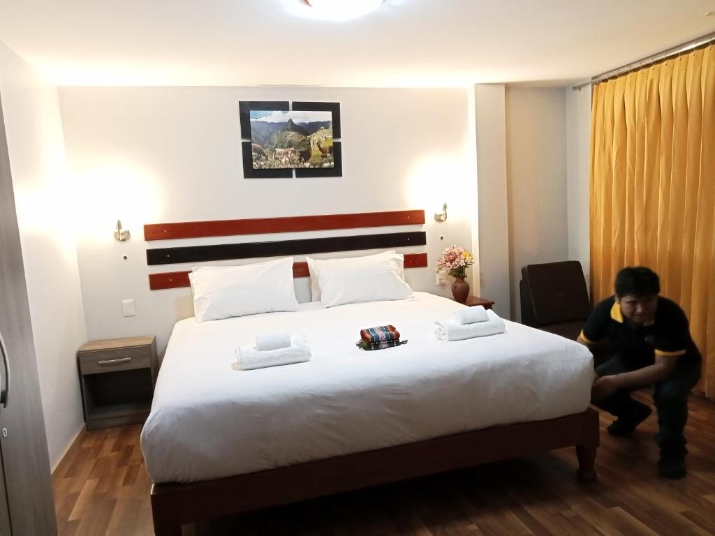 Postel nebo postele na pokoji v ubytování Raymi Inn MachuPicchu