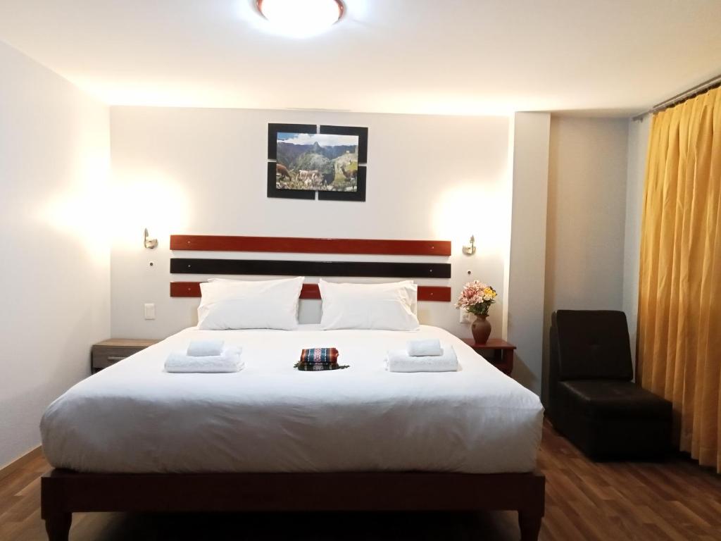 Postel nebo postele na pokoji v ubytování Raymi Inn MachuPicchu