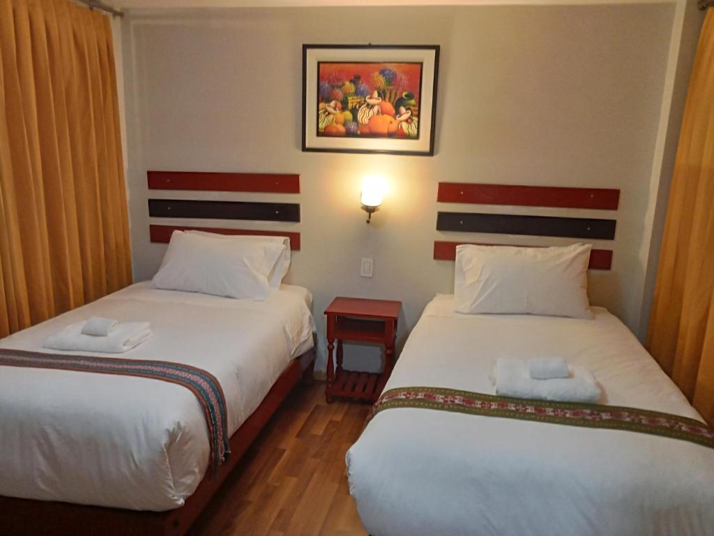 Postel nebo postele na pokoji v ubytování Raymi Inn MachuPicchu