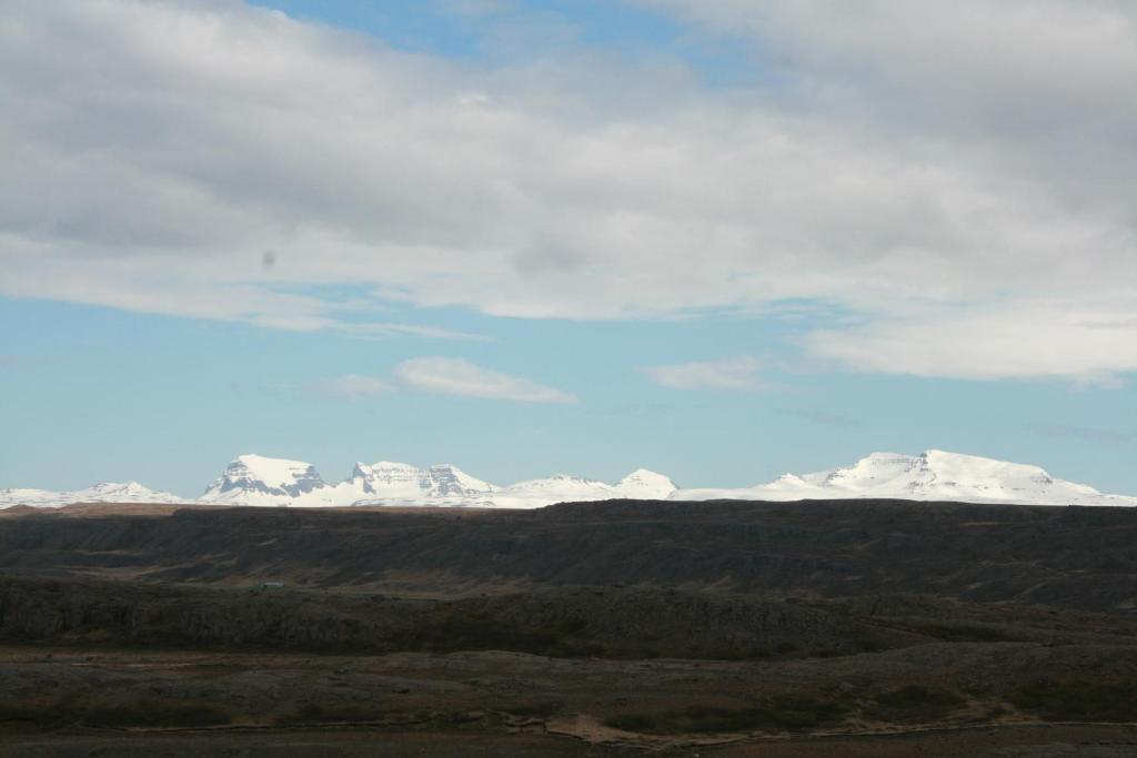 a view of snow covered mountains in the distance at Litlabjarg Guesthouse in Hrafnabjorg