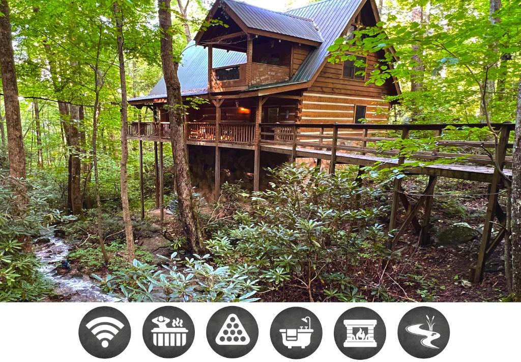 a tree house in the woods with a deck at Streamsong Secluded Creek View Cabin in Hatchertown