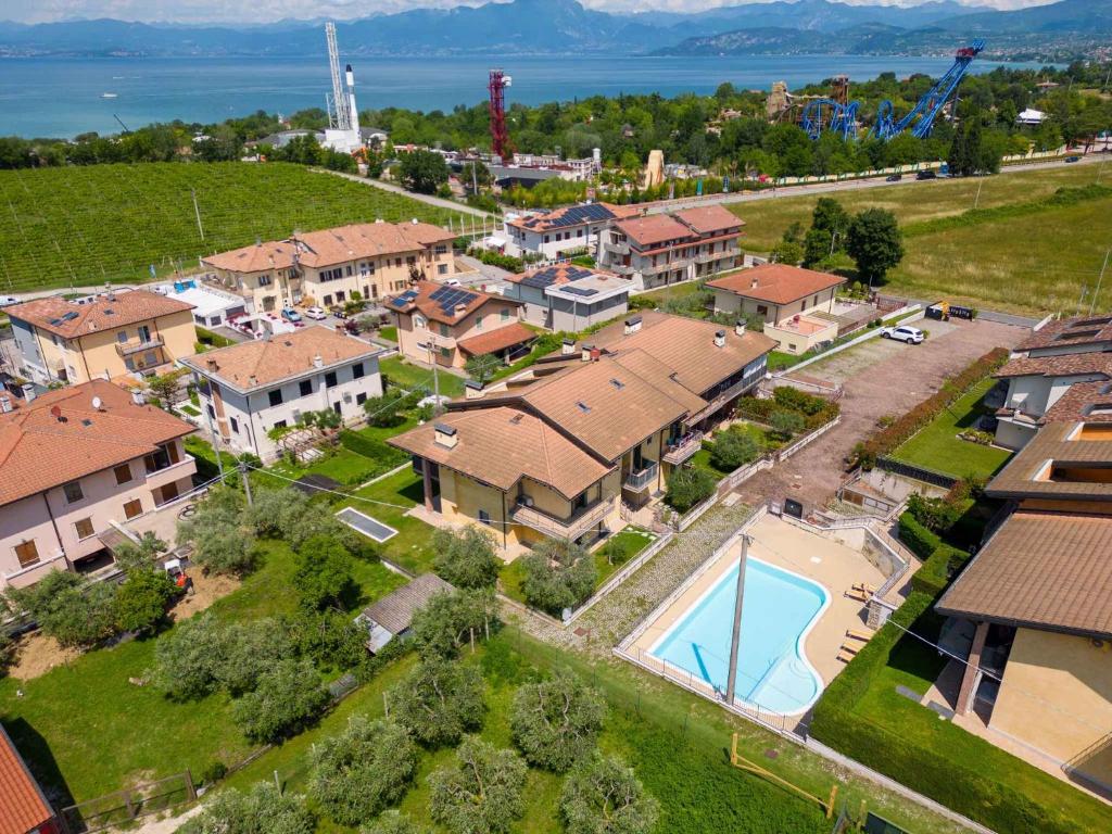 an aerial view of a house with a swimming pool at Apartment in Pacengo - Gardasee 45414 in Pacengo di Lazise