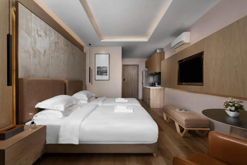 Postel nebo postele na pokoji v ubytování SF HOTEL Penthouse Residences