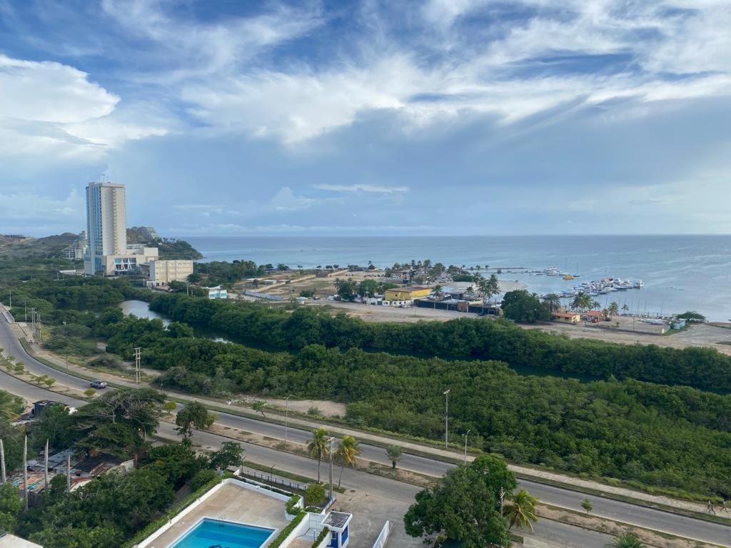 a view of the ocean from a building with a road at Apartamento Vista al Mar in Porlamar