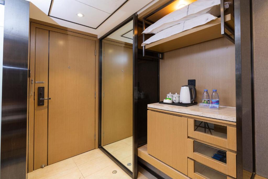 Kuchyň nebo kuchyňský kout v ubytování Orange Tree International Hotel Zhujiang New Town Huacheng Sqaure Branch - Free Shuttle Bus to Canton Fair Complex During Canton Fair Period