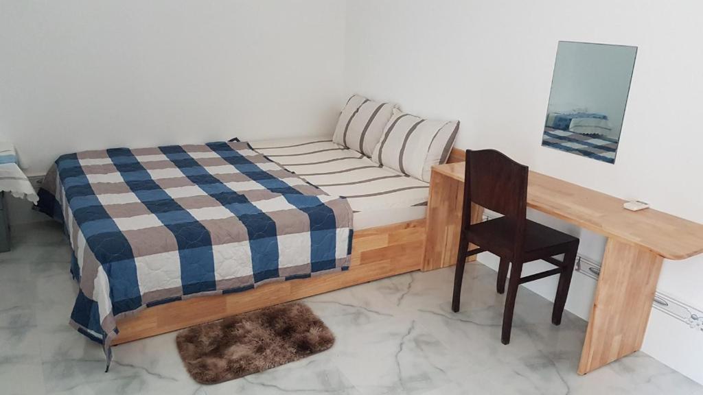 Postel nebo postele na pokoji v ubytování Hoa Lan Motel & Homestay