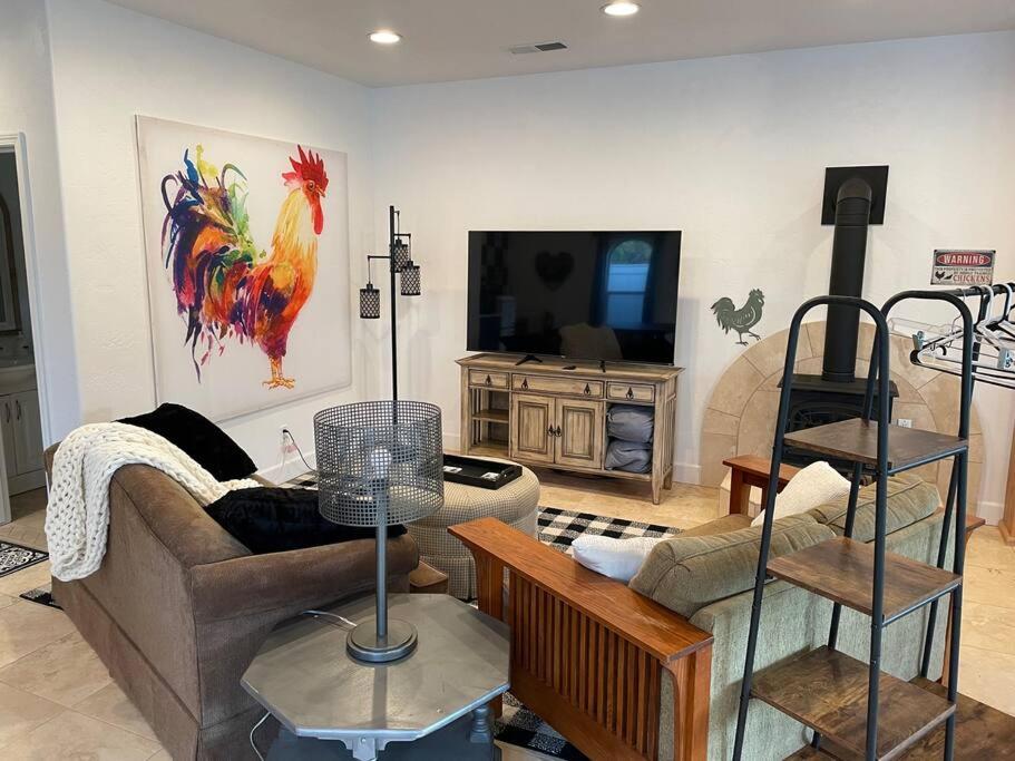 a living room with a couch and a tv at The Funky Chicken Hot Tub BBQ SLEEPS 4 in Ahwahnee