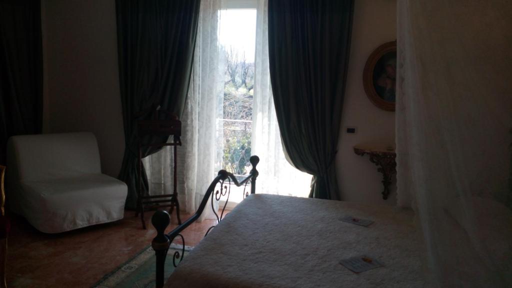 Posteľ alebo postele v izbe v ubytovaní B&B Vittoria Colonna