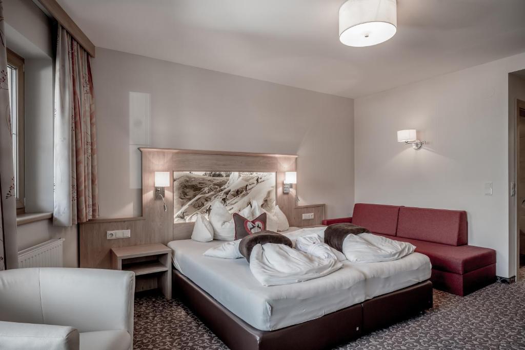 Postel nebo postele na pokoji v ubytování Hotel Elisabeth Superior Sölden