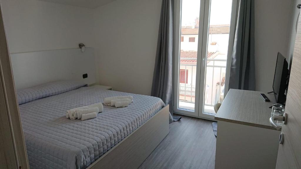 Posteľ alebo postele v izbe v ubytovaní Hotel Ogliastra