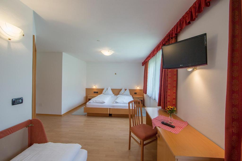 Postel nebo postele na pokoji v ubytování Hotel Gran Pre