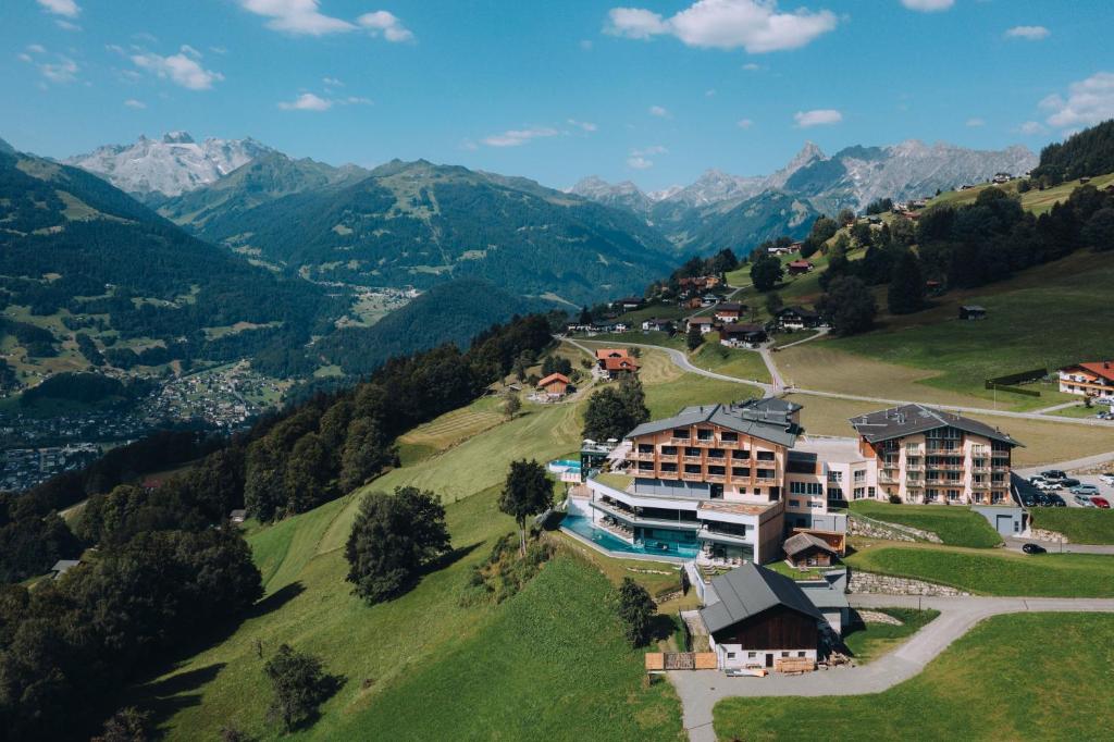 an aerial view of a resort in the mountains at Hotel Fernblick Montafon in Bartholomäberg