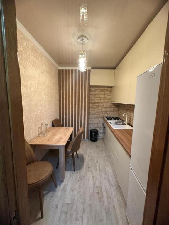Kuchyň nebo kuchyňský kout v ubytování Apartment George