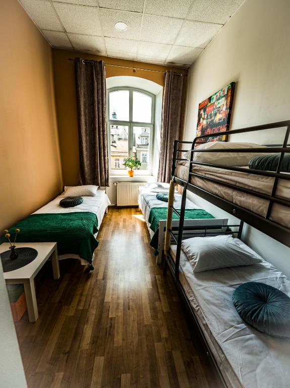 Postel nebo postele na pokoji v ubytování Hostel Pod Basztą