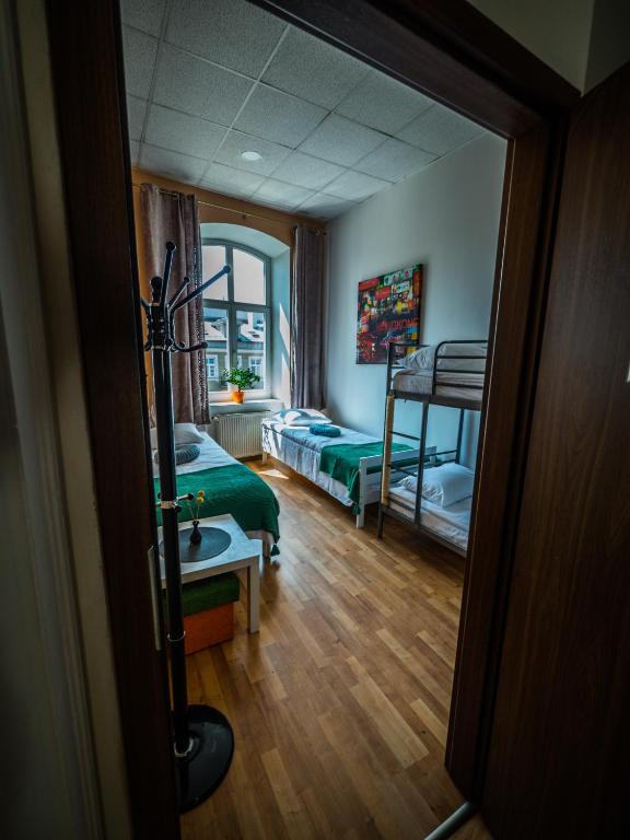 Postel nebo postele na pokoji v ubytování Hostel Pod Basztą