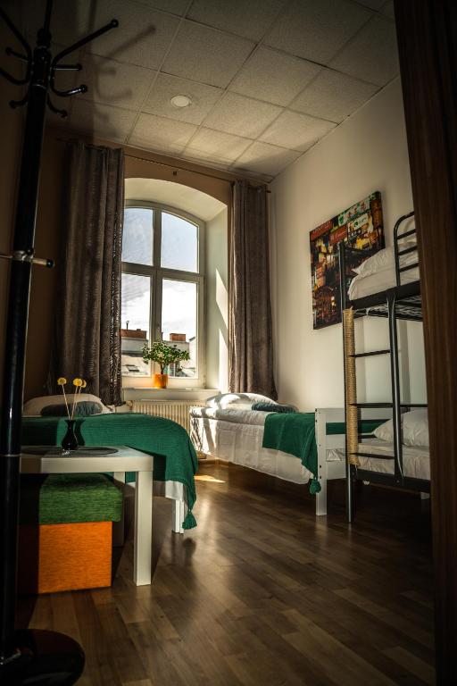 Postel nebo postele na pokoji v ubytování Hostel Pod Basztą