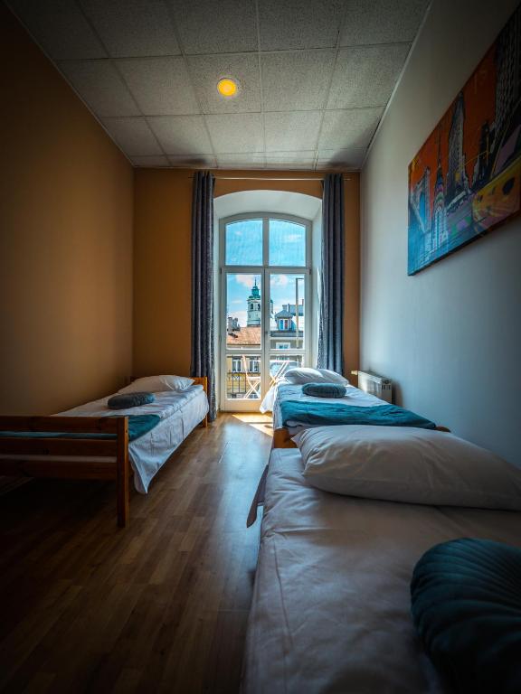 Postel nebo postele na pokoji v ubytování Hostel Pod Basztą