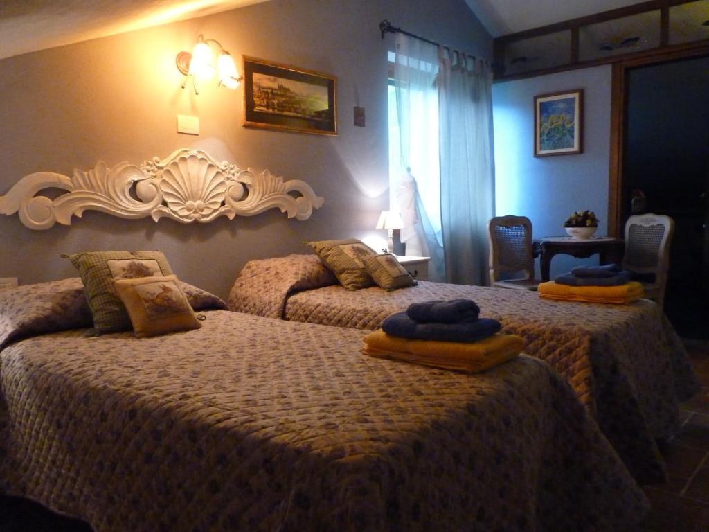 Posteľ alebo postele v izbe v ubytovaní B&B The Roses Garden