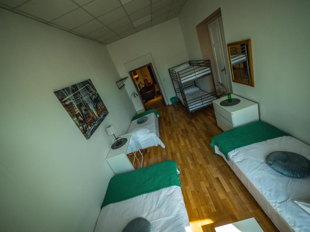 Postel nebo postele na pokoji v ubytování Hostel Pod Basztą