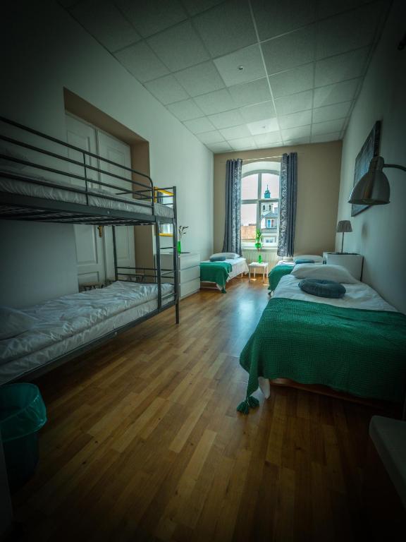 Postel nebo postele na pokoji v ubytování Hostel Pod Basztą