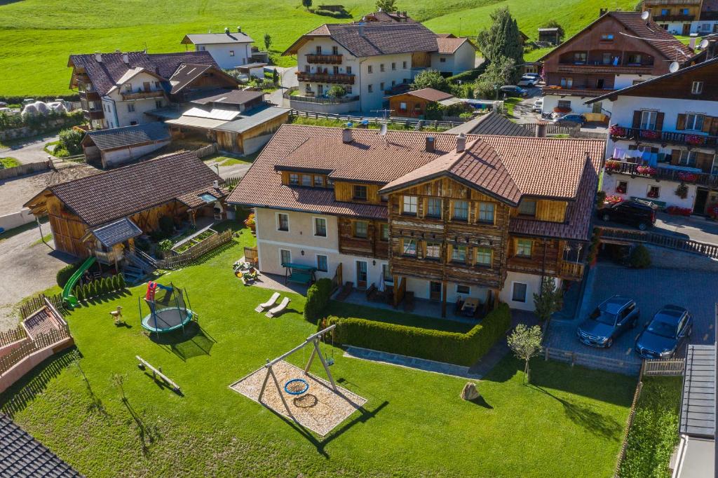 an aerial view of a large house with a yard at Hirschenhof in Dobbiaco