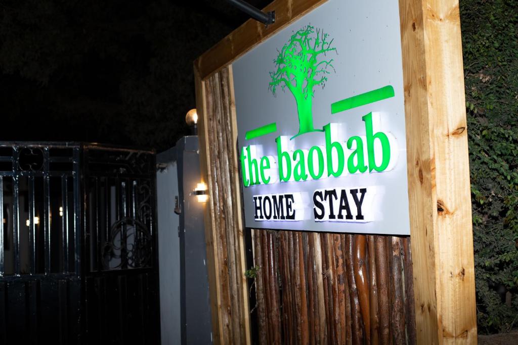 a sign for the brookfield home stay on a building at The Baobab Homestay in Dodoma
