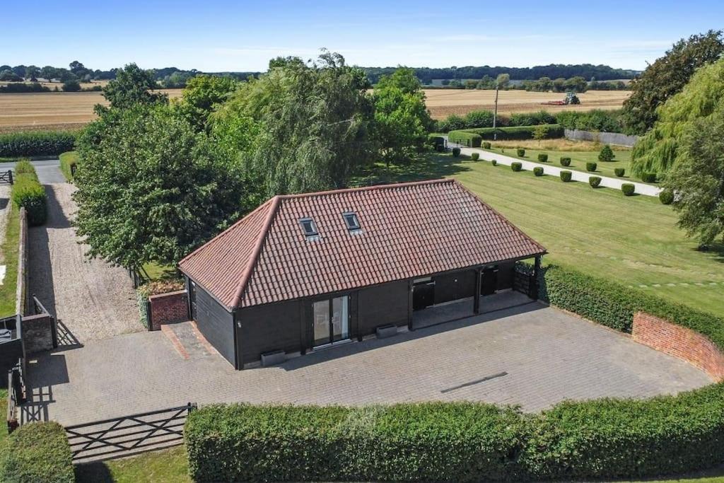 an overhead view of a house with a roof at The Stables Rectory Farm in Halstead