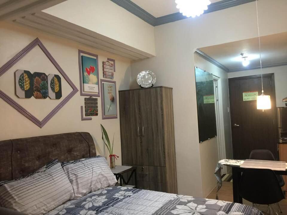 Postel nebo postele na pokoji v ubytování Condo for rent -The Loop Residences-relaxing , unique and satisfying