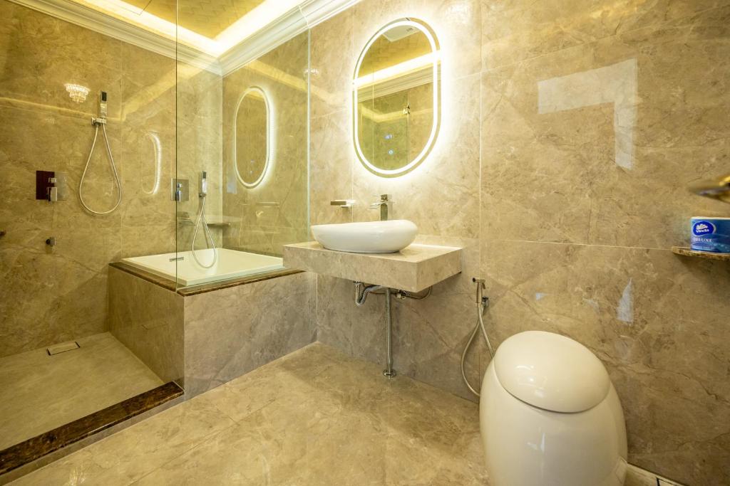 a bathroom with a sink and a shower and a toilet at Ritz Residence @ Imago Loft B 7th Floor in Kota Kinabalu