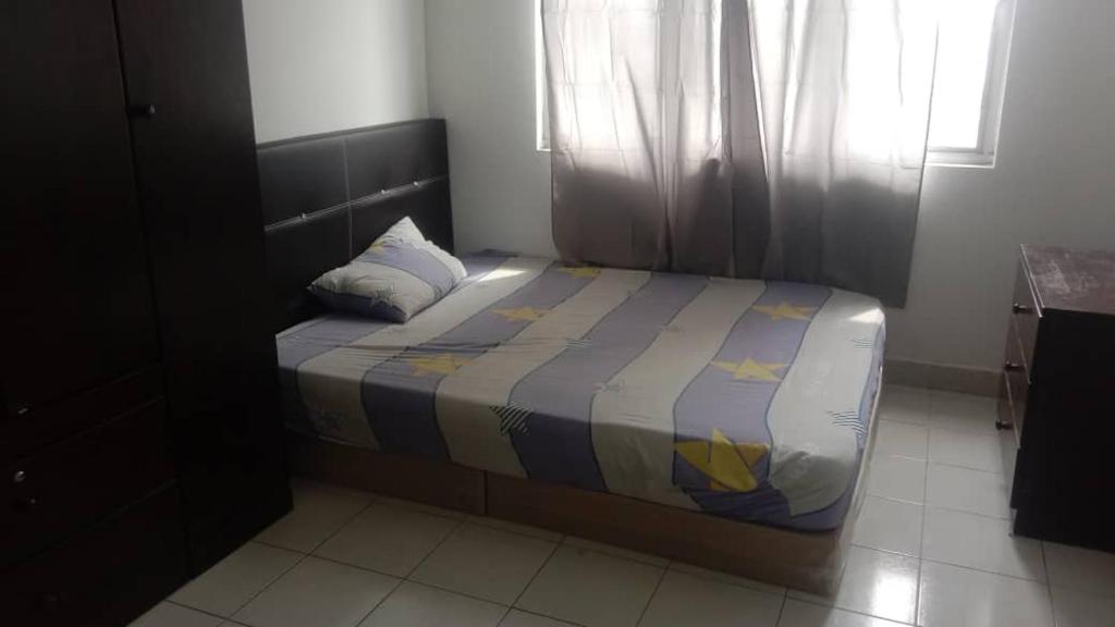 Postel nebo postele na pokoji v ubytování PR1MA Presint 11 Putrajaya