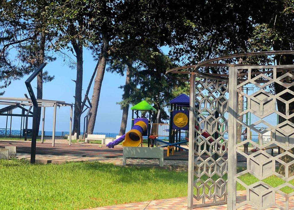 a playground with a slide in a park at Guest House Kobuleti on Aghmashenebeli in K'obulet'i