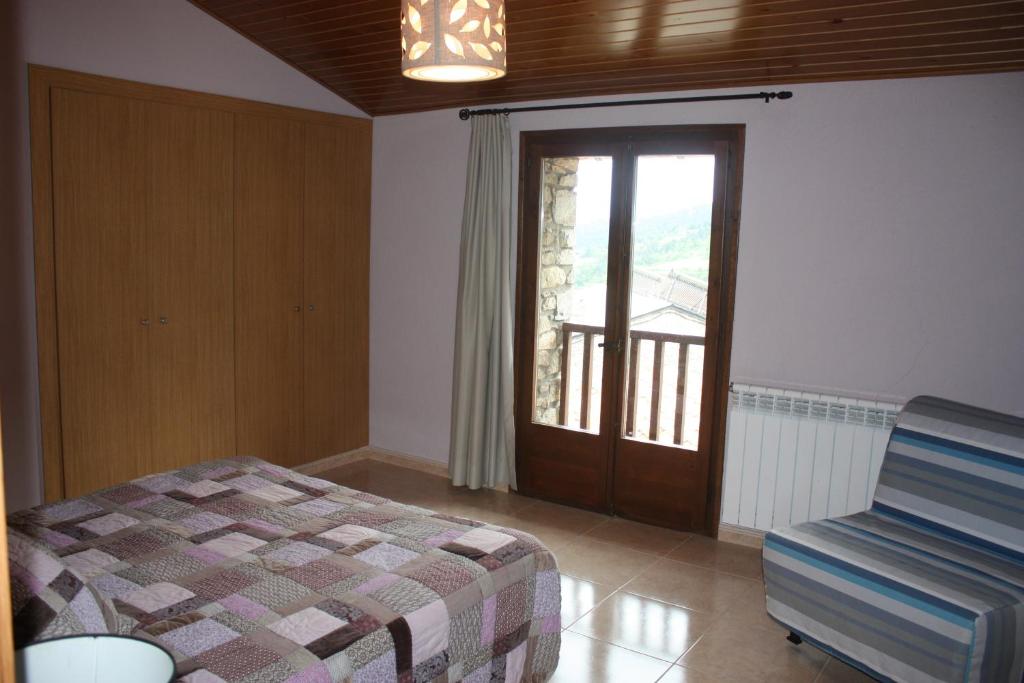 Postel nebo postele na pokoji v ubytování Cal Rosetó