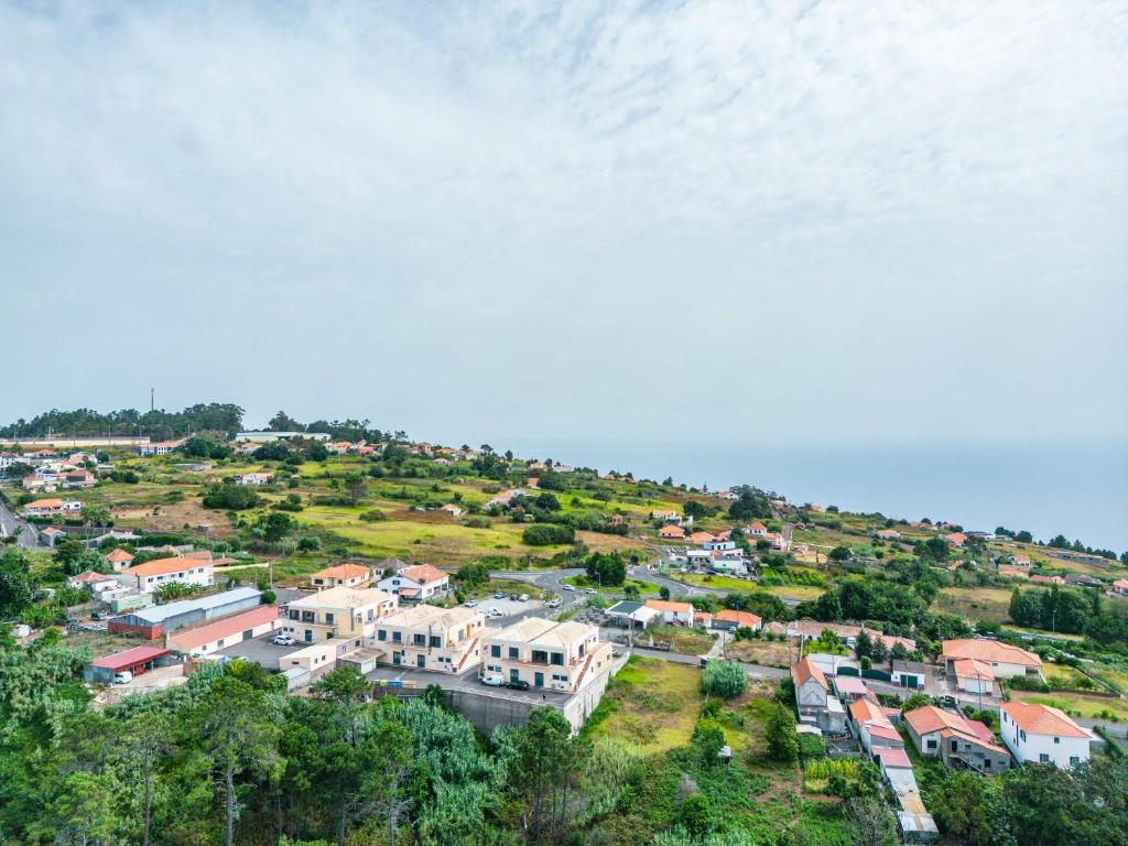 an aerial view of a town on a hill at Vila Sol in Prazeres