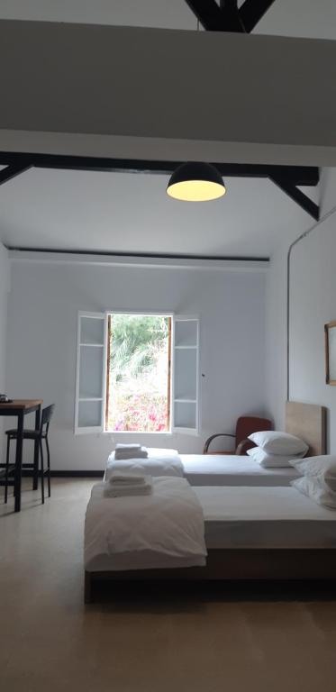 Postel nebo postele na pokoji v ubytování Sabor Residence