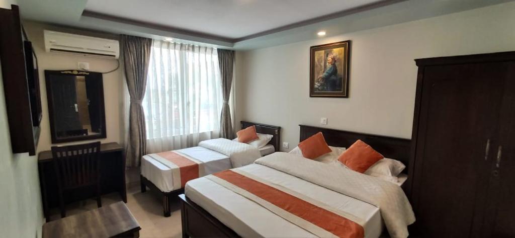 Postel nebo postele na pokoji v ubytování Hotel Pipal Tree