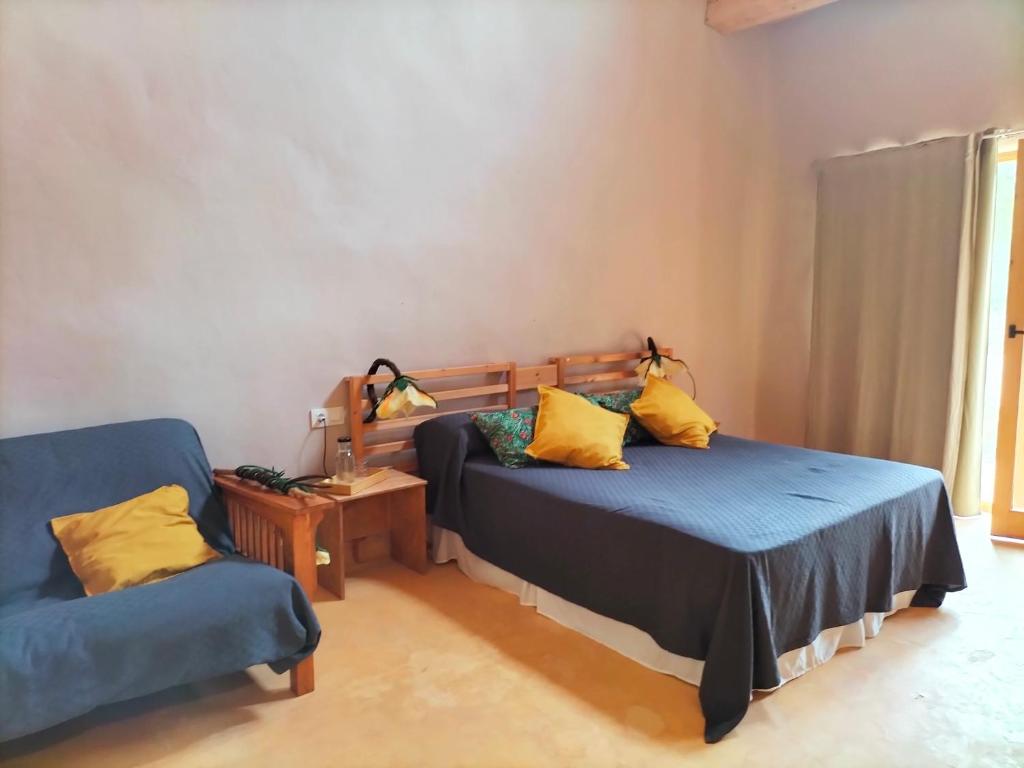 Postel nebo postele na pokoji v ubytování Mas la Llum, la casa de palla