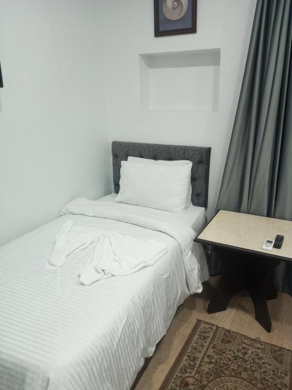 Postel nebo postele na pokoji v ubytování New Panorama Palace