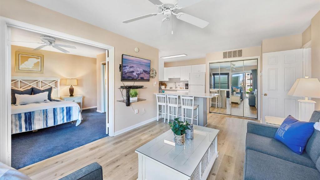 a living room with a bed and a couch at Lighthouse Point Villas in Ocean City