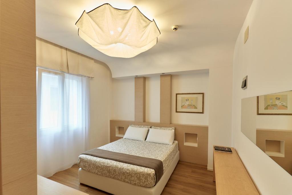 Postel nebo postele na pokoji v ubytování Hotel Saraceno Resort with Private Beach