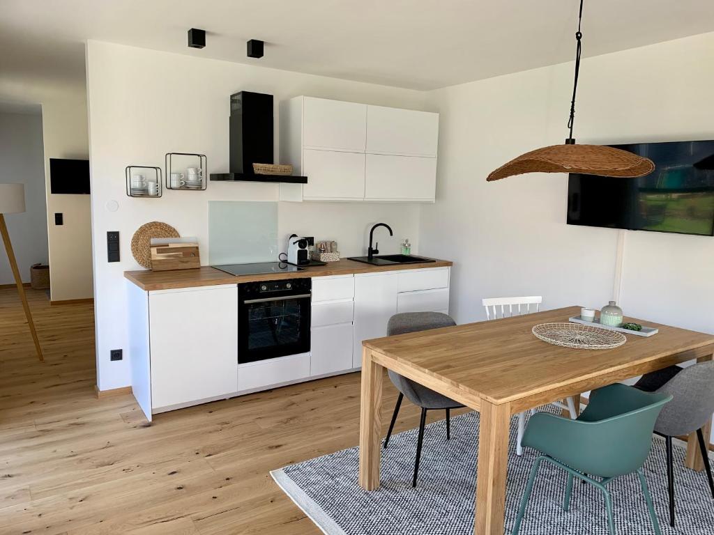Kuchyň nebo kuchyňský kout v ubytování Logis 11 Apartments