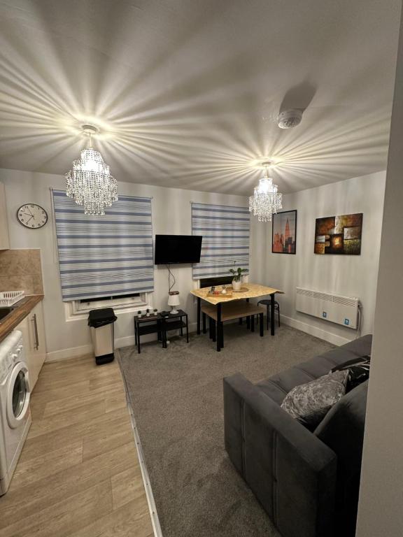 a living room with a couch and a table at Central London - Edgware Road 2 BEDROOMS FLAT in London