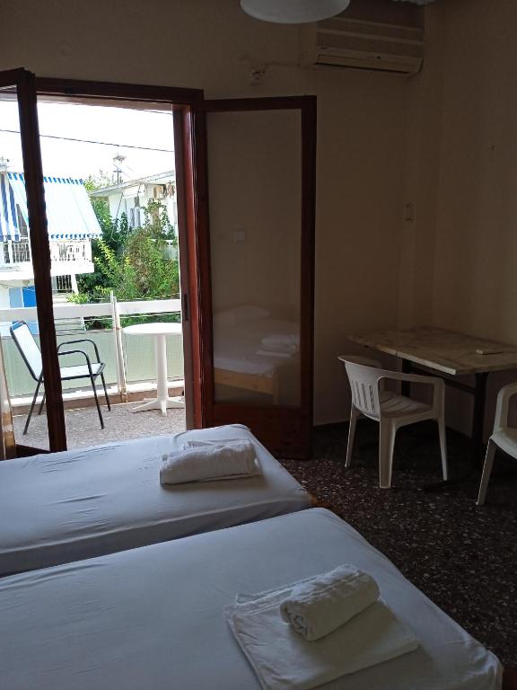Postel nebo postele na pokoji v ubytování PANAGIOTIS