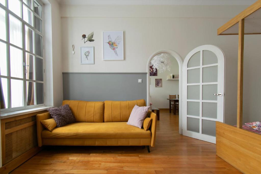 a living room with a couch and a table at Stylish 2 bedroom apartment Morsztynowska street in Kraków